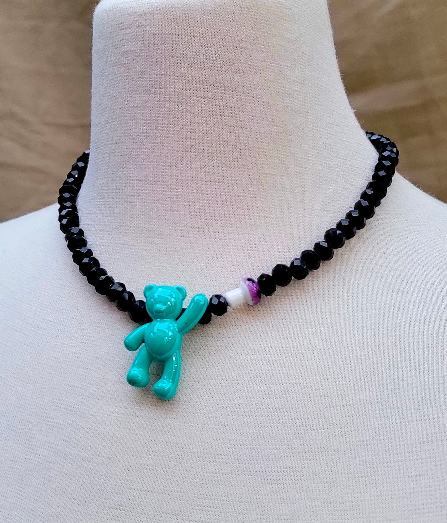 Close-up of playful teddy bear necklace – Trish T CoCo